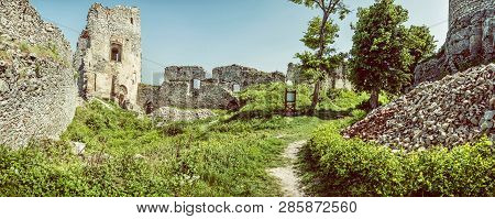 Ruins Of The Castle Gymes In Slovak Republic. Travel Destination. Panoramic Photo. Old Photo Filter.