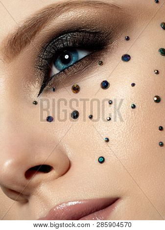 Close Up Beauty Portrait Of Young Woman With Beautiful Fashion Makeup. Modern Fashion Makeup. Long L