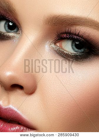 Beauty Portrait Of Young Woman With Fashion Make Up. Perfect Skin And Colorful Smokey Eyes Makeup. S