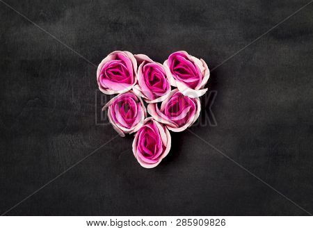 Heart Of Pink Roses On Black Backgraund. Top View. Copy Space. Flat Lay. Greeting Card