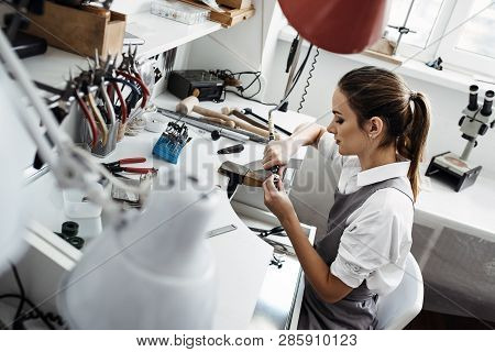 She Is So Passionate About Her Project... Side View Of Young Female Jeweler Working On A New Jewelry