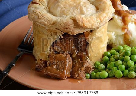 Closeup Steak Pub Pie With Gravy And Fork