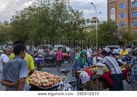 Turpan, China - August 10, 2012: People At A Street Market In The City Of Turpan, Xinjiang Region.