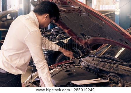 This Career Man Saleman Business Inspection Writing Note On Notepad Or Book, Paper With Car Blurry B