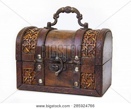 An Old Chest Made Of Wood And Leather With An Iron Handle And Lock