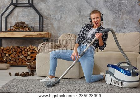 Full Length Portrait Of Cheerful Young Woman 20s Listening To Music Via Headphones And Having Fun Wi