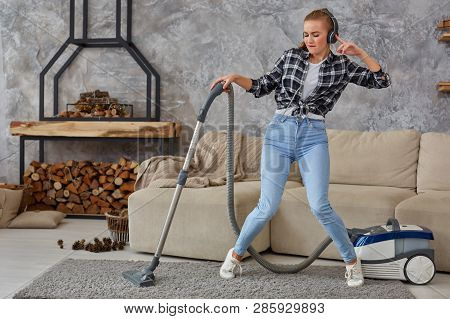 Full Length Portrait Of Cheerful Young Woman 20s Listening To Music Via Headphones And Having Fun Wi
