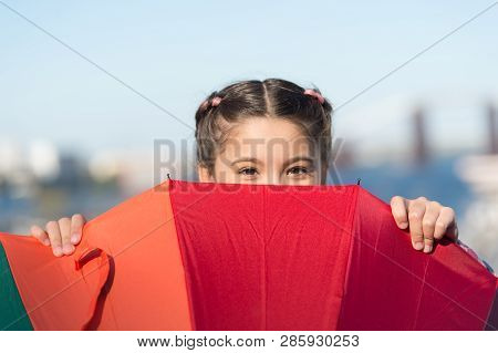 Hiding From Problems. Positive And Bright. Girl Cute Child Standing With Colorful Umbrella. Child Be