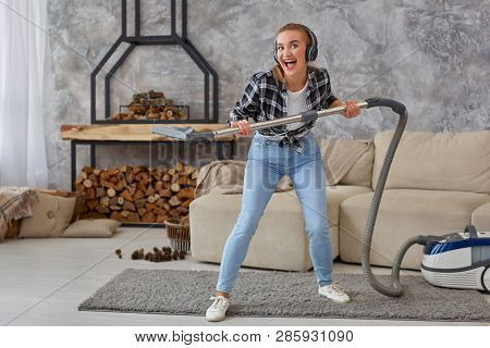 Full Length Portrait Of Cheerful Young Woman 20s Listening To Music Via Headphones And Having Fun Wi