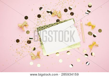 Blank Sheet Of Paper, Notebook On A Festive Pink Background With Golden Confetti And Glitter. Univer