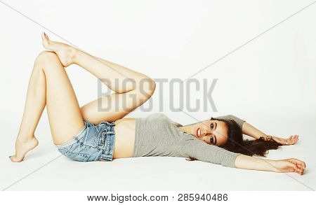 Young Pretty Brunette Woman Head Over Heels On White Isolated