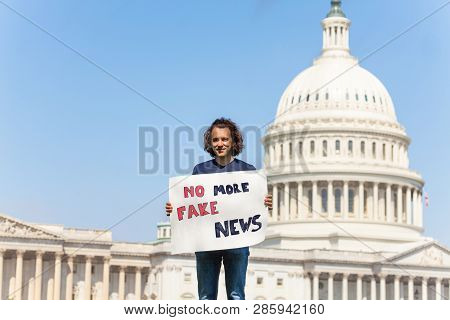 Protester Holding Sign Saying No More Fake News