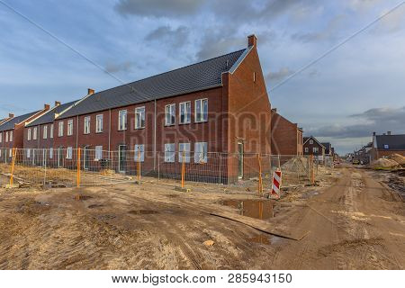 Newly Built Houses In Modern Street Building Site In Suburb Of City In The Netherlands