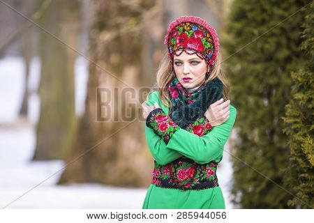Sensual Caucasian Blond Girl In Fashionable Green Dress And Kokoshnik With Flowery Pattern And Beads