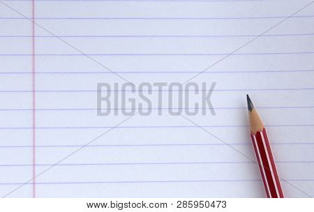 School, Education Concept - Red Pencil Close Up And Composition Of Notebook. The Beginning Of The Sc