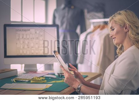 Fashion Designer Woman Working On Her Designs In The Studio.