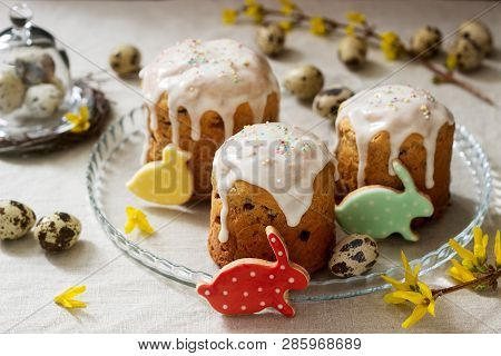 Easter Composition Of Easter Cakes, Biscuits, Eggs And Forsythia Flowers. Rustic Style.
