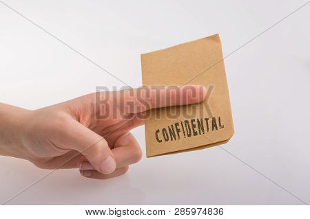 Brown Paper  Text Confidental On A White Background
