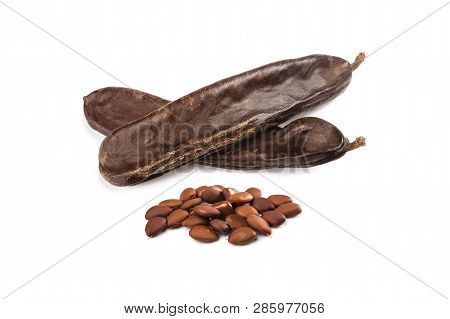 Carobs Pod With Beans Isolated On White Background