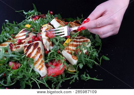 Salad With Grilled Halumi With Pomegranate And Arugula