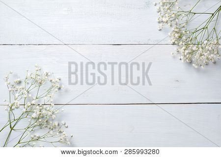 Spring Background, Flowers Frame On Blue Wooden Table. Banner Mockup For Womans Or Mothers Day, East