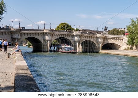 Boat Traffic Under The Pont Neuf - Paris, France. Pont Neuf Is The Oldest Standing Bridge Across The