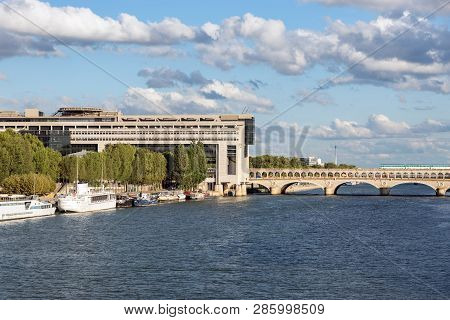 Paris, France - August 13, 2018: Metro Crossing Bercy Bridge With French Ministry For The Economy An