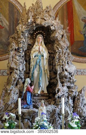 DONJA ZELINA, CROATIA - JUNE 26, 2013: Our Lady of Lourdes at Saint Nicholas Parish Church in Donja Zelina, Croatia