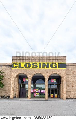 Vertical Shot Of An Out Of Business Store In Vertical Format With Foreground Copy Space.