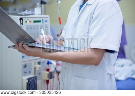 The Specialist Are Checking Continuous Renal Replacement Therapy Equipment And Injection Pump And He