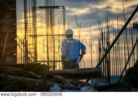 The Foreman Checking Of Construction Worker On Building Site.