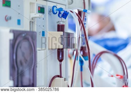 The Specialist Are Doing Continuous Renal Replacement Therapy Equipment And Injection Pump.