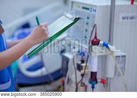 The Specialist Are Doing Continuous Renal Replacement Therapy Equipment And Injection Pump.