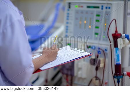 The specialist are doing continuous renal replacement therapy equipment and injection pump.