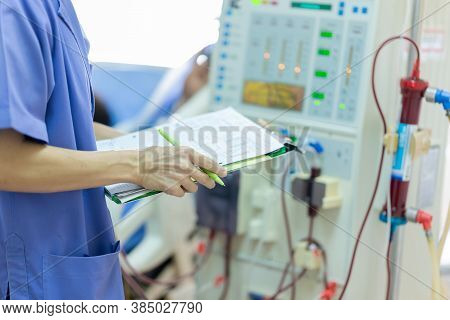The Specialist Are Checking Continuous Renal Replacement Therapy Equipment And Injection Pump And He