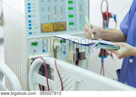 The Specialist Are Checking Continuous Renal Replacement Therapy Equipment And Injection Pump And He