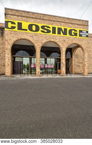 Vertical Shot Of An Out Of Business Store In Vertical Format With Foreground Copy Space.