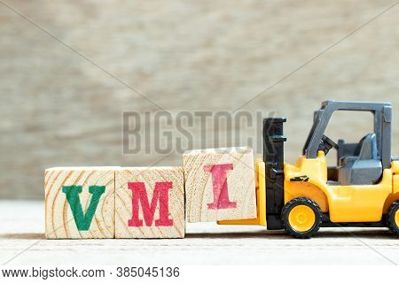 Toy Forklift Hold Letter Block I To Complete Word Vmi (abbreviation Of Vendor Managed Inventory) On 
