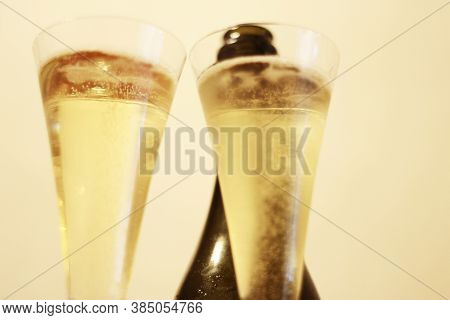 Bottle Of Shampagne And A Two Glasses Of Cold Shampagne Before Drinking Isolated On The White Backgr
