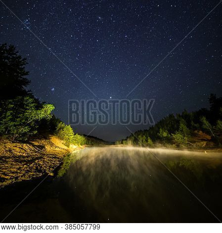 Small Lake Under Stars At Night With Foggy Vapour At Summer