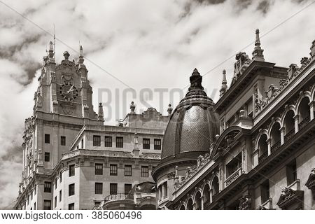 MADRID, SPAIN - MAY 13, 2018: Telefonica Building rise above historical buildings on Gran Via business district.