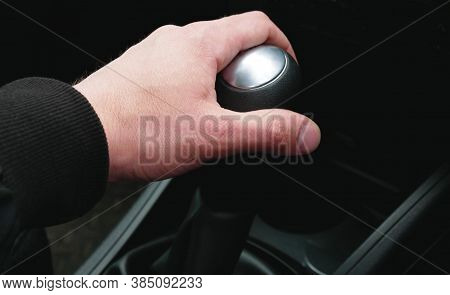 Hand On The Gearshift Selector In The Car, Close-up. Right-hand Drive Cars.