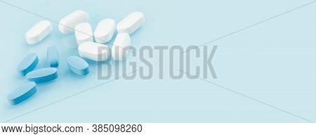 Medical Banner Of Many White And Blue Capsule Tablets Or Pills On The Table. Close Up Edgeless. Heal