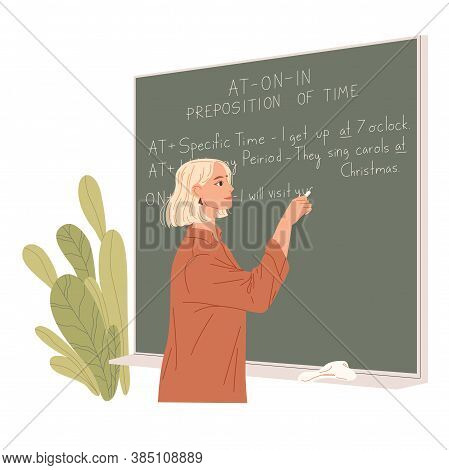 English Teacher Writes On A Chalkboard. Foreign Language Lesson