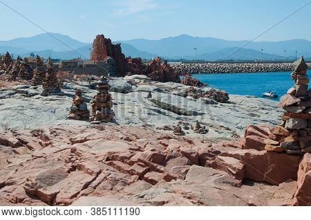 Sardinia Coastline: Typical Red Rocks And Cliffs Near Sea In Arbatax; Italy