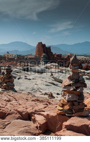Sardinia Coastline: Typical Red Rocks And Cliffs Near Sea In Arbatax; Italy