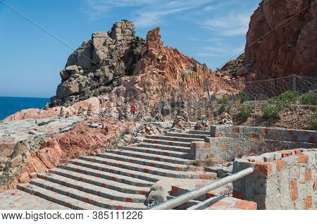 Sardinia Coastline: Typical Red Rocks And Cliffs Near Sea In Arbatax; Italy