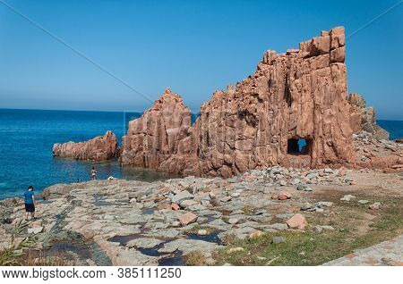Sardinia Coastline: Typical Red Rocks And Cliffs Near Sea In Arbatax; Italy