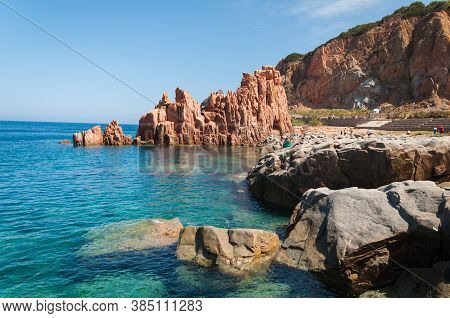 Sardinia Coastline: Typical Red Rocks And Cliffs Near Sea In Arbatax; Italy