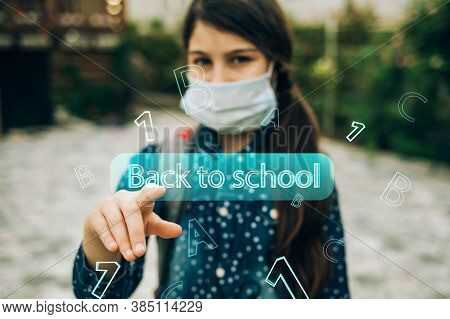 Girl In A Medical Mask Goes To School. She Connects Online. New Rules For Schoolchildren In A Pandem